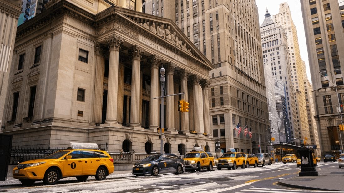 The imposing edifice of a courthouse with classic architectural columns stands solemnly in the city, as New York yellow cabs drive past on the street, symbolizing the urban setting for the upcoming sentencing of FTX founder Sam Bankman-Fried.